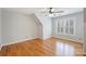 This upstairs bedroom has hardwood floors, neutral paint and windows to let in lots of natural light at 8000 Greencastle Dr, Charlotte, NC 28210