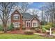 Charming two-story brick home featuring manicured landscaping and a welcoming front entrance at 8000 Greencastle Dr, Charlotte, NC 28210