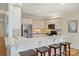 Kitchen features stainless steel appliances, a breakfast bar, and classic white cabinets at 8000 Greencastle Dr, Charlotte, NC 28210