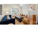 Bright living room with hardwood floors, ample seating, and a large bay window at 8000 Greencastle Dr, Charlotte, NC 28210