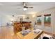 Open floor plan living room featuring hardwood floors, and outdoor access to the home's wooden deck at 8000 Greencastle Dr, Charlotte, NC 28210