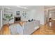 Cozy living room featuring built-in shelving, a fireplace, and hardwood floors for a warm inviting feel at 8000 Greencastle Dr, Charlotte, NC 28210