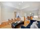 Open-concept living area with hardwood floors and views into the dining room at 8000 Greencastle Dr, Charlotte, NC 28210