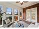 Cozy sunroom featuring plenty of natural light and access to the home's wooden deck at 8000 Greencastle Dr, Charlotte, NC 28210