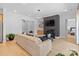 Comfortable living room featuring a modern fireplace, a large TV, and a view into the bedroom at 8004 Brookbank Dr, Charlotte, NC 28269