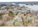 Aerial view of a home surrounded by trees, on lake with a boat dock at 8143 Summit Ridge Dr # 41, Catawba, NC 28609