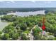 Expansive aerial view of a home nestled in lush greenery near a serene lake at 8143 Summit Ridge Dr # 41, Catawba, NC 28609