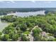 Expansive aerial view of a home nestled in lush greenery near a serene lake at 8143 Summit Ridge Dr # 41, Catawba, NC 28609