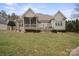 Backyard view of screened porch, patio, and professional landscaping at 8143 Summit Ridge Dr # 41, Catawba, NC 28609