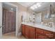 Bathroom with a wood vanity, marble countertop, framed mirror and shower at 8143 Summit Ridge Dr # 41, Catawba, NC 28609