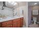 Well-lit bathroom featuring a vanity with marble countertops, a modern sink and a walk-in shower at 8143 Summit Ridge Dr # 41, Catawba, NC 28609