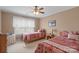Bright bedroom with two twin beds, neutral walls, carpeted floors, and a ceiling fan at 8143 Summit Ridge Dr # 41, Catawba, NC 28609