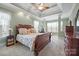 Main bedroom showing tray ceiling, wooden furniture, and sitting area at 8143 Summit Ridge Dr # 41, Catawba, NC 28609