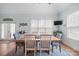 Bright dining room featuring a large window, hardwood table, and stylish chairs at 8143 Summit Ridge Dr # 41, Catawba, NC 28609