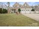 Charming two-story home with a manicured lawn, three-car garage and a beautiful blend of siding and stone at 8143 Summit Ridge Dr # 41, Catawba, NC 28609