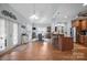 Open floorplan kitchen and dining area with wood floors, barstool seating, and stainless steel appliances at 8143 Summit Ridge Dr # 41, Catawba, NC 28609