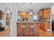 Open kitchen concept with granite countertops, wood cabinets, stainless steel appliances, and barstool seating at 8143 Summit Ridge Dr # 41, Catawba, NC 28609