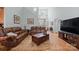 Spacious living room with cathedral ceilings, hardwood floors and stylish leather furnishings at 8143 Summit Ridge Dr # 41, Catawba, NC 28609