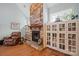 Comfortable living room showcasing a stone fireplace, hardwood floors and charming built-in cabinets at 8143 Summit Ridge Dr # 41, Catawba, NC 28609