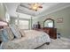Luxurious main bedroom with tray ceiling, sitting area, and elegant decor at 8143 Summit Ridge Dr # 41, Catawba, NC 28609