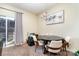 Cozy dining room with a round table, chandelier, and natural light from sliding glass door at 8460 Summerglen Cir, Charlotte, NC 28227