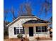 Charming single Gathering home with a covered porch, black shutters, and a white picket fence at 8900 Moores Chapel Rd, Charlotte, NC 28214