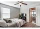 Comfortable bedroom featuring a ceiling fan, window, and convenient doorway access to another room at 921 Von Buren Blvd, Rock Hill, SC 29730