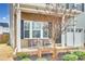 Inviting front porch featuring rocking chairs and a landscaped garden at 921 Von Buren Blvd, Rock Hill, SC 29730