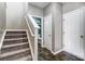 View of the stairway to the left, a white door to the right, and the opening to a half-bathroom at 921 Von Buren Blvd, Rock Hill, SC 29730