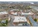 Aerial view of the city with buildings and businesses, with ample parking space and well-maintained streets at 105 Hillside Dr, Davidson, NC 28036