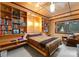 Cozy bedroom with built-in shelving, a large bed, and a window with a serene outdoor view at 105 Hillside Dr, Davidson, NC 28036