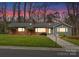 Street view of brick and siding home with landscaped yard and sidewalk to front door at 105 Hillside Dr, Davidson, NC 28036