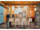 Open concept kitchen with barstool seating, modern appliances, and stone tile floors at 105 Hillside Dr, Davidson, NC 28036