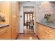 Modern kitchen featuring custom cabinetry, sleek countertops, and seamless flow to dining room at 105 Hillside Dr, Davidson, NC 28036