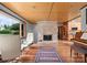 Bright living room with modern fireplace, hardwood floors, ample natural light and refined furnishings at 105 Hillside Dr, Davidson, NC 28036