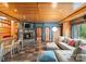 Spacious living room featuring a stone fireplace, tv, and large comfortable seating, perfect for relaxing at 105 Hillside Dr, Davidson, NC 28036