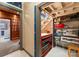 A storage room with shelving and view to bathroom with blue towel and bathtub at 105 Hillside Dr, Davidson, NC 28036