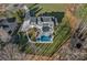 Stunning aerial view of estate featuring in-ground pool, manicured lawn, and mature landscaping at 111 Kent Ct, Mooresville, NC 28117