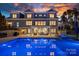 Backyard with large in-ground pool, outdoor seating area, and manicured landscaping at 111 Kent Ct, Mooresville, NC 28117