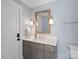 Elegant bathroom with a granite countertop vanity, modern fixtures, and a decorative mirror at 111 Kent Ct, Mooresville, NC 28117