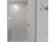 Modern bathroom featuring stylish tile, glass shower door, and sleek fixtures at 111 Kent Ct, Mooresville, NC 28117