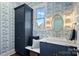 Charming bathroom with elegant wallpaper, a marble countertop, and stylish fixtures at 111 Kent Ct, Mooresville, NC 28117