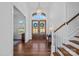 Elegant foyer with hardwood floors, grand staircase, and stylish lighting fixtures at 111 Kent Ct, Mooresville, NC 28117