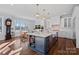 Bright, open kitchen with a large island, modern appliances, and an adjacent dining area at 111 Kent Ct, Mooresville, NC 28117