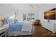Bright main bedroom with large windows, hardwood floors, lake views, and ensuite bathroom at 111 Kent Ct, Mooresville, NC 28117