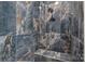 Luxurious shower featuring artistic tile work, a rainfall shower head, and a built-in bench at 111 Kent Ct, Mooresville, NC 28117