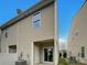 Exterior view of the townhouse featuring a small backyard patio and AC unit at 120 Cadbury Ln, Fort Mill, SC 29715
