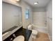Bathroom featuring a tub, shower, vanity with black granite countertop, and tile floor at 120 Cadbury Ln, Fort Mill, SC 29715