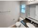 Bathroom featuring a granite-topped vanity, large mirror, and a window for natural light at 120 Cadbury Ln, Fort Mill, SC 29715