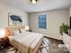 Staged bedroom with a plush bed, contemporary decor, and a bright window at 120 Cadbury Ln, Fort Mill, SC 29715